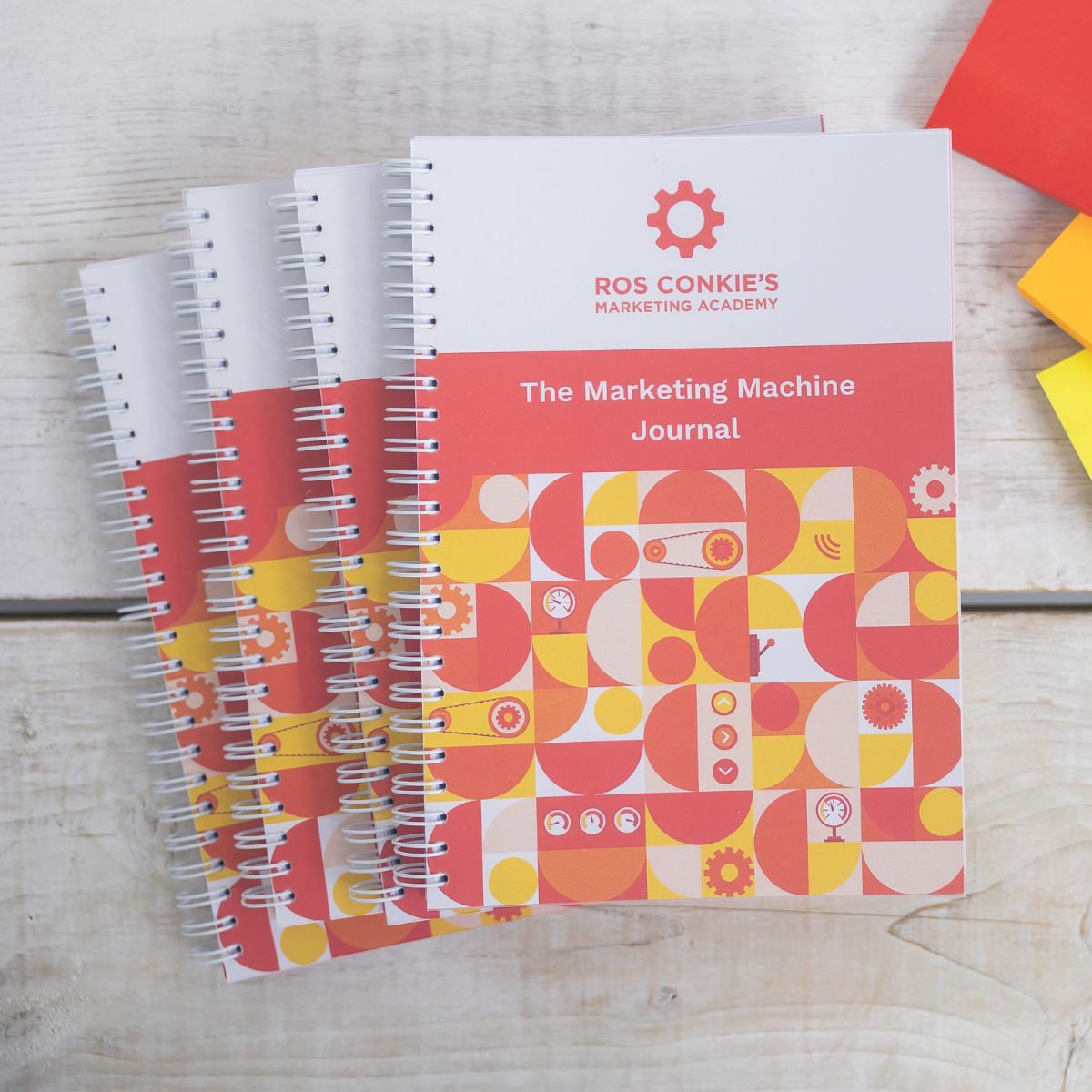 Stack of Marketing Machine Journals