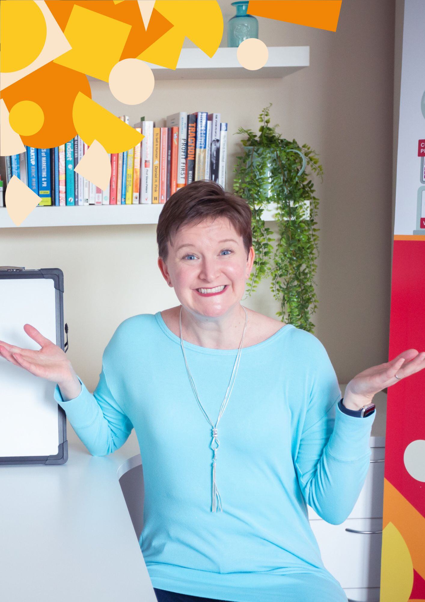 Ros at her desk smiling with her arms in a questioning pose