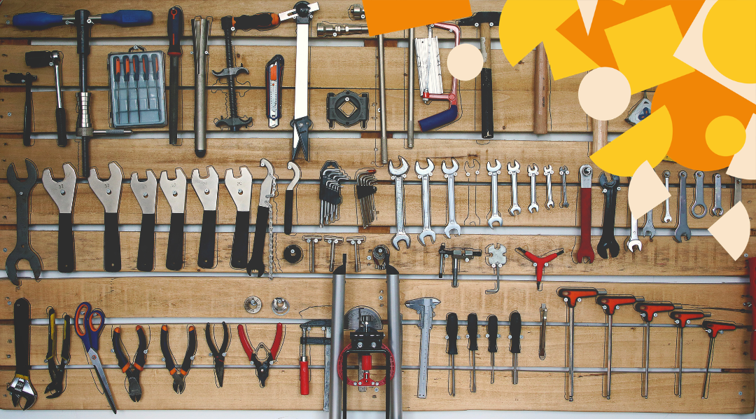 A workshop wall of dozens of near-identical tools, illustrating the overwhelming choice of AI tools available.