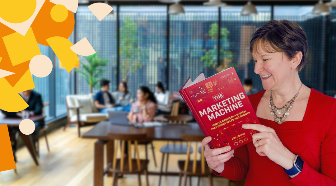 Ros Conkie reading The Marketing Machine in a co-working space