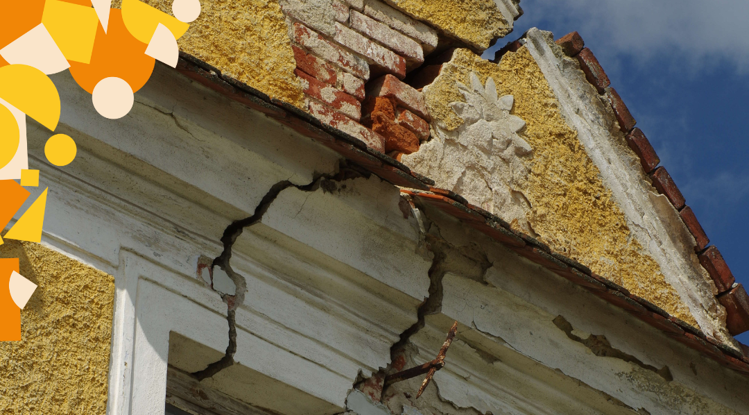A house with cracks across the walls and roof