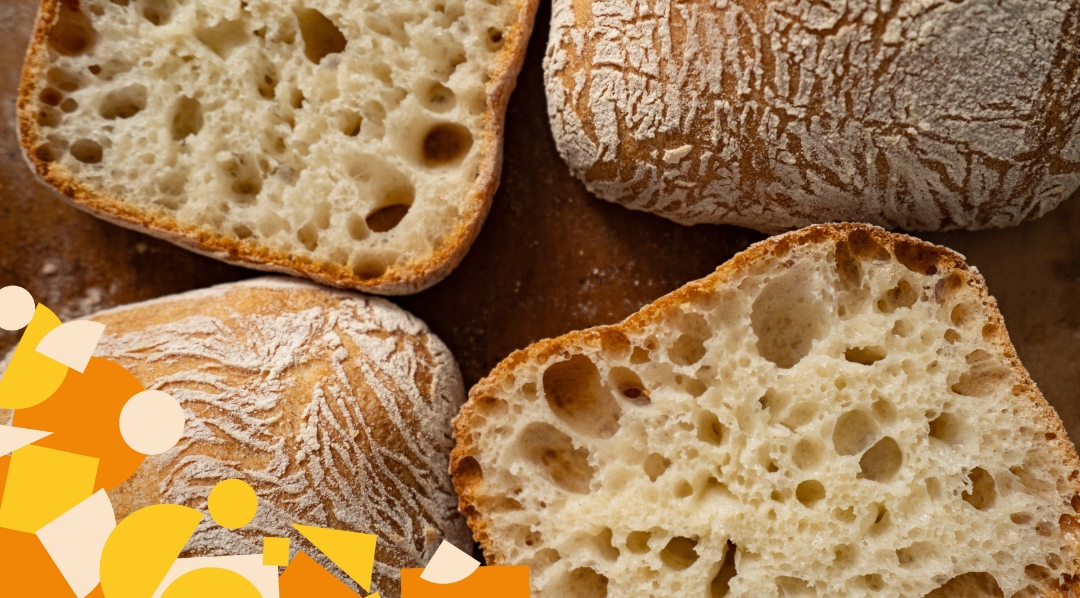 Bread rolls sliced in half showing the holes made by the yeast
