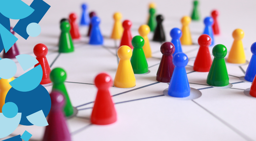 Colouful pawns on paper with lines connecting the pieces